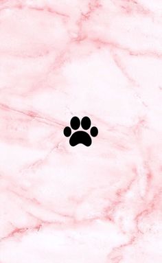 a pink marble background with a black paw print