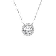 That one piece that will inject a shot of glamour into your looks. This white gold necklace features round diamond surrounded by a halo of smaller round diamonds. Four prongs secure the center diamond in place. The timeless look of this necklace allows you to pair it with almost any of your favorite outfits. Halo Pendant Diamond Necklace With Cubic Zirconia, Cubic Zirconia Halo Pendant Diamond Necklace, Diamond Necklace With Halo Setting, Halo Cubic Zirconia Pendant Diamond Necklace, Halo Pendant Cubic Zirconia Diamond Necklace, Classic Halo Diamond Necklace In Cubic Zirconia, Classic Cubic Zirconia Diamond Necklace With Halo, Classic Cubic Zirconia Halo Diamond Necklace, Classic Halo Diamond Necklace With Round Pendant