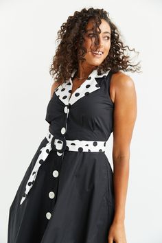 Fit and Flare Sleeveless Polka Dot Midi DressAdelaide Alluring is the perfect dress for you to take out for a spin for anything from a picnic to a party.  The front button closing and 3/4 flared skirt with side seam pockets create a stylish and playful look.  With a contrast collar and belt, this bold look is sure to make you feel like you can accomplish anything.Designed and manufactured in AustraliaFit and flare A-line design to flatter hipsV-neckline to suit all bust sizesEasy front button op Sleeveless Midi Dress, Contrast Collar, Button Dress, Effortless Chic, Flared Skirt, Midi Dress Sleeveless, Black Polka Dot, Independent Designers Fashion, Black Midi Dress