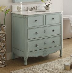 a bathroom with a sink, mirror and rug