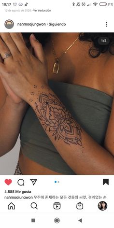 a woman with a tattoo on her arm