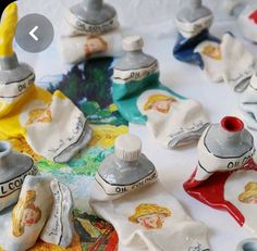 several different types of pottery sitting on top of a table