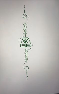 a drawing on the side of a white wall with green lines and symbols in it