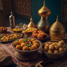 a table topped with bowls filled with different types of food