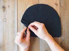 a person is working on a black hat