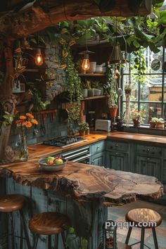 a rustic kitchen with green cabinets and wooden stools in front of the counter top