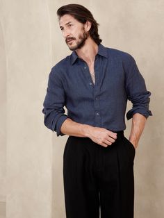 Cut from 100% linen, we love this shirt for its beautiful, natural texture and ability to stay cool and crisp, even in heat and humidity.  Standard fit.  Spread collar with button-front closure.  Shirttail hem.  Standard fit.  Long sleeves.  Hip length.  Model: Size M, 6'2" (188cm). Club Outfit Night, What To Wear In Paris, Dark Blue Shirt, Navy Blue Shirts, Linen Shirt Men, Men Formal, Navy Linen, Men Shirt Style, Stay Cool