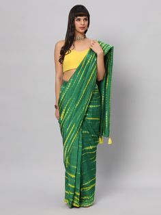 This light weight Green Tie dye saree is a versatile saree that is a must have in your wardrobe. This saree is extremely light weight will give you great pitures and can be worn for different ocassions. Team this saree up with Yellow raw silk blouse & statement earrings. Suitable for Poojas, Day function, brunhes, Wedding & haldi functions. Product Features: Saree Color: Green & yellow Blouse Color: Yellow Saree Fabric: Georgette silk Blouse Fabric: Raw Silk Saree Work: Tie Dye Print Wash Care: Unstitched Green Raw Silk Choli, Green Chanderi Pre-draped Saree For Festivals, Green Chanderi Pre-draped Saree For Puja, Green Cotton Silk Lehenga With Unstitched Blouse, Green Cotton Lehenga With Dupatta, Green Tussar Silk Pre-draped Saree With Dupatta, Green Slub Silk Pre-draped Saree For Diwali, Festive Green Designer Saree, Green Semi-stitched Tussar Silk Blouse Piece