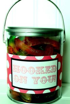 a jar filled with lots of candy sitting on top of a table