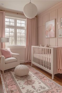 a baby's room with pink and white decor, including a crib, chair, rug, and window