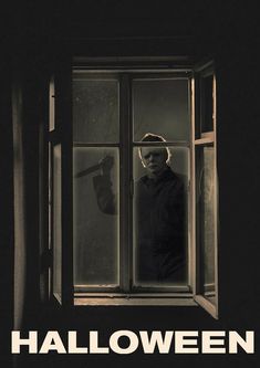 a man standing in front of an open window with the words halloween written on it