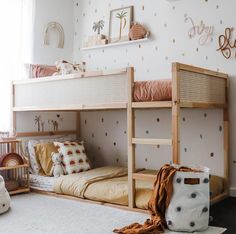 a child's bedroom with bunk beds and toys