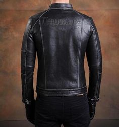 Genuine leather, cafe-style jacket Slide that swagger on from the not-so-bygone days of the Ace Café, where cafe racing culture started when the Rocker and "Ton-Up Boys" were raising hell in London with their modified customs. This handsome cowhide leather biker jacket is made by Urban Baron in the authentic style of a classic cafe racer jacket. It features a British flag patch, multiple zippers to carry your shit in, and a snap fastener for a stand up collar. SPECS Material: Genuine cowhide lea Streetwear Cafe Racer Leather Jacket, Streetwear Cafe Racer Leather Jacket With Long Sleeves, Cafe Racer Leather Jacket For Streetwear, Fitted Moto Leather Jacket For Biker Events, Cafe Racer Biker Jacket For Motorcycling, Cafe Racer Biker Jacket With Long Sleeves For Motorcycling, Winter Fitted Cafe Racer Biker Jacket, Fitted Cafe Racer Biker Jacket For Motorcycling, Cafe Racer Long Sleeve Biker Jacket For Motorcycling