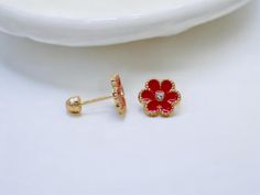 - 14K gold earrings featuring vibrant and glossy red enamel flower decor, perfect for adding a playful touch. - Kid-Friendly Screw Backs : Designed with secure screw backs for safe and comfortable wear, ideal for children. - Crafted from solid 14K gold, ensuring long-lasting beauty and strength. - A charming and age-appropriate accessory for kids or youth, great for everyday wear. - Ideal for birthdays, special occasions, or just to make your little one feel special. ------------------------ * Each item is carefully crafted and comes ready to gift in a jewelry box.   * We offer a 14-day return policy and most items ship within 1-2 business days, though this may vary during peak seasons.  * Feel free to message us with any questions--happy to help!   * Follow our shop for more exciting prod Red Floral Decor, Gold Flower Earrings, Earrings Red, Enamel Flower, Gold Flower, Everyday Jewelry, Gold Flowers, Flower Earrings, Red Floral