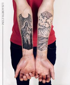 two hands holding each other with tattoos on their arms and the same person's arm