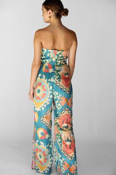 Beautiful, strapless jumpsuit with a structured top for the most flattering fit. Featuring a wide leg cut with slits on the side, this piece is perfect for your next vacation or getaway. Runs true to size 100% poly Structured Top, Strapless Jumpsuit, End Of Season Sale, Tie Top, Tie Dress, On The Side, Paloma, Wide Leg, Jumpsuit