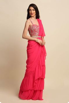 Buy Pink Dupion And Georgette; Lining: Shantoon Ruffle Saree With Blouse For Women by Priyanka Jain Online at Aza Fashions. Pink Sleeveless Ruffled Set, Pink Georgette Blouse Piece With Ruffles, Fitted Ruffled Saree, Pink Saree Blouse Piece With Ruffles, Pink Saree With Ruffles For Diwali, Pink Ruffled Saree For Diwali, Festive Pink Pre-draped Saree With Ruffles, Wedding Blouse Piece With Ruffles, Sleeveless Pink Blouse For Reception