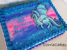 a birthday cake with a blue and purple dragon on it