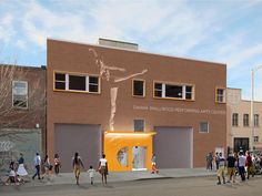 a group of people standing in front of a building with a mural on the side