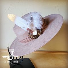 If you’re looking for the perfect accessory to complement your favorite boho style, look no further. This Boho-Style Western Felt Hat w/ Natural Feather & Turquoise Hat Accent by The Jewelry Junkie is absolutely everything that you need. Not only is it easy to incorporate into any and all outfits, but the genuine leather and natural feathers of the band immediately elevate whatever it is you’re wearing. One Size Hat with adjustable inner hat liner (see last photos) The same primary feathers will Turquoise Hat, Western Hat, Leather Hat, Medium Handbags, Packing Jewelry, Western Hats, Leather Hats, Turquoise Howlite, Handbag Straps