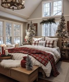 a bedroom decorated for christmas with white and red decorations on the bed, windows, and lights