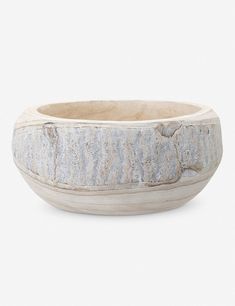 a white bowl sitting on top of a table