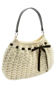 a white purse with black trims on it