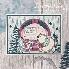 a christmas card with a bear and snow scene