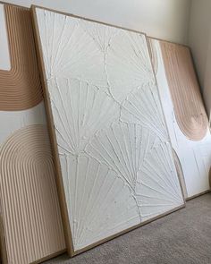 three panels with different shapes and sizes on them