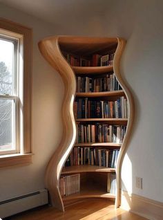 a curved book shelf in the corner of a room