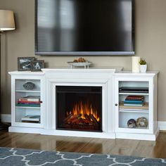 a television mounted on the wall above a fireplace