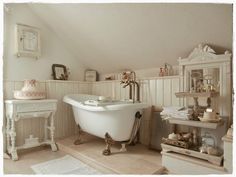 an old fashioned bathtub in a white bathroom with antique furniture and decor on the walls