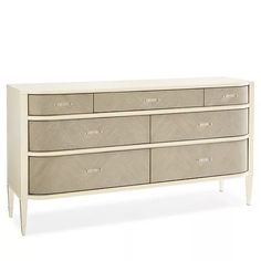 a white dresser with four drawers and two handles