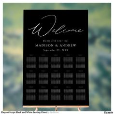 a black and white wedding seating sign with the word welcome on it in cursive writing