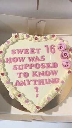 a heart shaped cake with pink frosting and roses on it that says sweet 16 how was supposed to know anything?