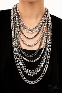 Featuring a range of oval and curb style links, a chaotic assortment of bulky silver and gunmetal chains fearlessly layers down the chest. Polished silver beads and textured silver discs swing from the thick curb chains, introducing audible shimmer to the intense industrial design. as two strands of high-sheen silver beads, chiseled into faceted metallic accents, drape between the mashup of tiered chains in a dramatic finish. Features an adjustable clasp closure. Sold as one individual necklace. Bling Necklace, Paparazzi Accessories, Polish Silver, Black Necklace, Affordable Jewelry, Paparazzi Jewelry, Metallic Accents, Necklace Earring Set, Accessories Necklace