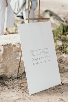 an easel with a sign on it that says welcome to husband and wife