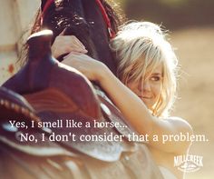 a woman is hugging a horse with the caption yes, i smell like a horse no, i don't consider that a problem