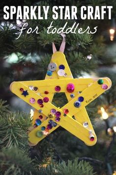 a star ornament hanging from a christmas tree with the words sparkly star craft for toddlers