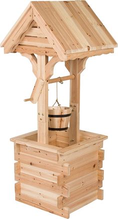 a wooden structure with a bucket on top