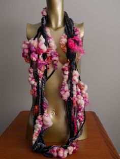 a mannequin is adorned with flowers and beads