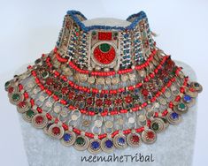 Vintage handmade Kuchi Nomad Tribal-Choker with mostly red and green glass jewels and a layer of dangling coinpendants with a glass jewel on each dangle. This Tribal-Choker is vintage but in an excellent condition. It has still the old lining and maybe you want to renew or to cover it with new fabric. From the weight you can tell that this is one of the old excellent handicraft quality ones. Lenght 31 cm / 12.20 ", hight 14 cm / 5.51 " Weight 388 g This is real vintage authentic Kuchi nomad jewe Afghan Jewelry, Afghan Fashion, Real Vintage, Choker Necklaces, Good Old, Green Glass, The Old, Choker Necklace, Purses And Bags