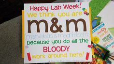 a sign that says happy lab week we think you are m & m