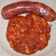 two sausage patties on a plate next to each other