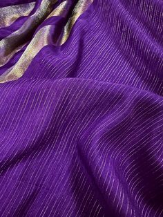 Exclusive Collection of Soft Satin Tissue Silk Saree in Purple Color. Saree is soft like butter has Zari Weave in Gold and Platinum Zari. Very Flowy, Easy to drape and Premium quality at unbeatable price. Item : SareeColor : Purple Color Base Fabric : Banarasi Soft Satin Tissue Silk Blouse piece : YesBlouse material : Banarasi SilkFall & Edging(Pico) Yes/No : Yes Champagne - Color variation is possible due to various reasons like phone or desktop setting, resolution etc. Please don't hold us res Purple Cotton Silk Blouse With Zari Weaving, Purple Cotton Silk Dupatta With Self Design, Purple Self-design Cotton Silk Dupatta, Festive Purple Cotton Silk Saree, Elegant Cotton Silk Saree In Purple, Festive Purple Cotton Silk Pre-draped Saree, Festive Purple Pre-draped Cotton Silk Saree, Bollywood Style Slub Silk Blouse Piece For Celebrations, Purple Cotton Silk Pre-draped Saree