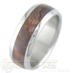 a wedding ring with wood inlays on the outside and inside, made from stainless steel