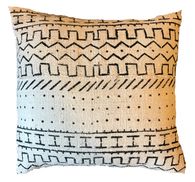 a black and white pillow on a white background