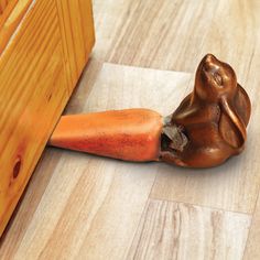 a piece of wood that has been placed on the floor with a hammer in it