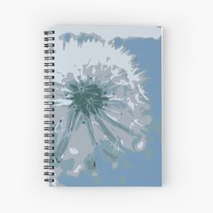 a dandelion flower in blue and white spiral notebook with watercolor effect on it