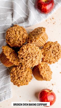 some muffins and an apple on a table